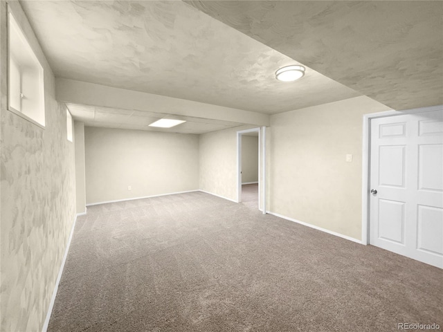 basement featuring carpet flooring