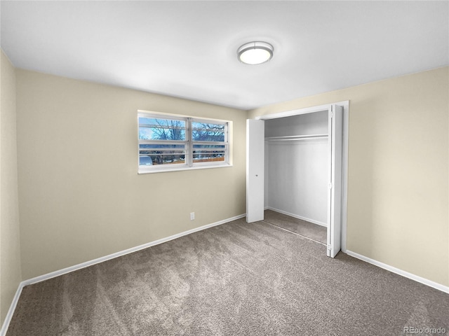 unfurnished bedroom featuring a closet and carpet flooring