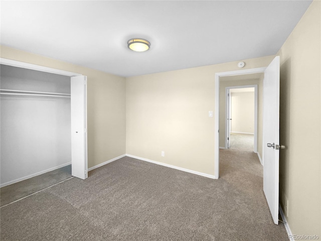 unfurnished bedroom featuring a closet and carpet flooring