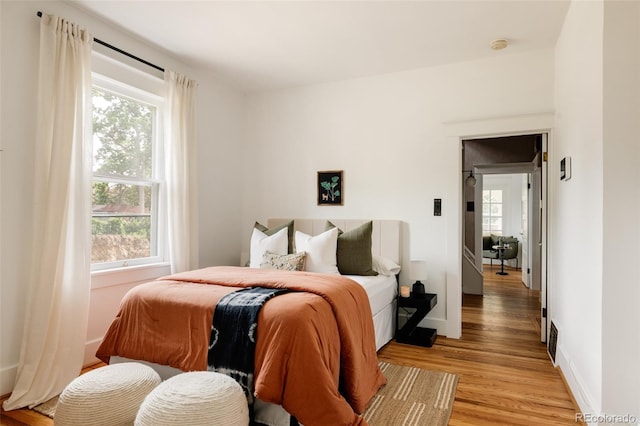 4224 N Clay St, Denver, CO 80211 - bedroom featuring light wood-style floors and baseboards