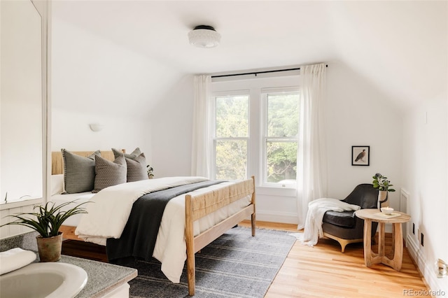 4224 N Clay St, Denver, CO 80211 - bedroom featuring lofted ceiling and light wood finished floors