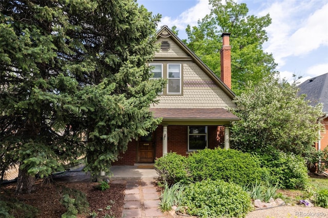 4224 N Clay St, Denver, CO 80211 - victorian-style house with a porch, a chimney, and brick siding