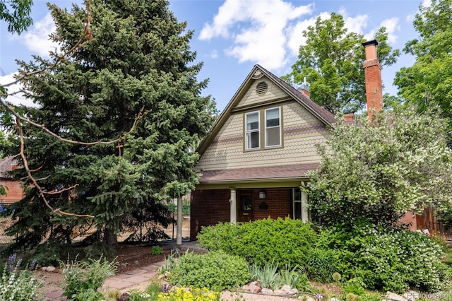 4224 N Clay St, Denver, CO 80211 - view of front of property featuring a chimney and brick siding