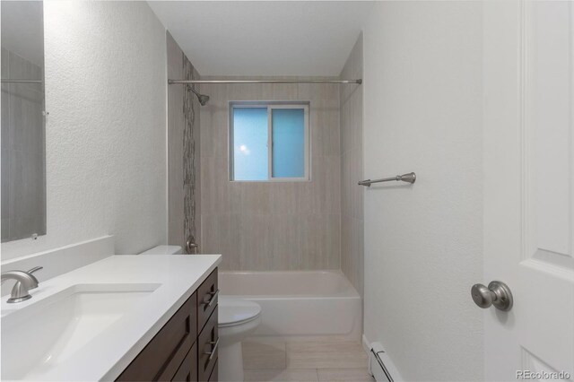 8467 W 62nd Pl, Arvada, CO 80004 - full bathroom featuring tile patterned flooring, vanity, toilet, shower / bathtub combination, and a textured wall