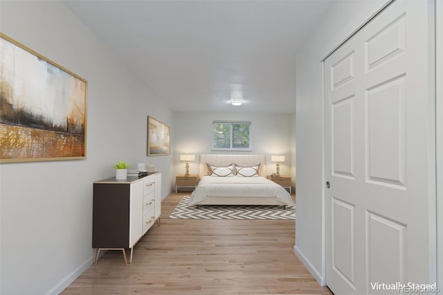 bedroom with light wood-type flooring