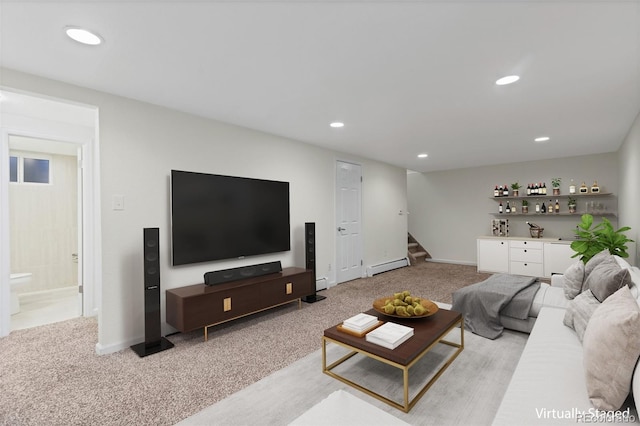 carpeted living room featuring bar and a baseboard radiator