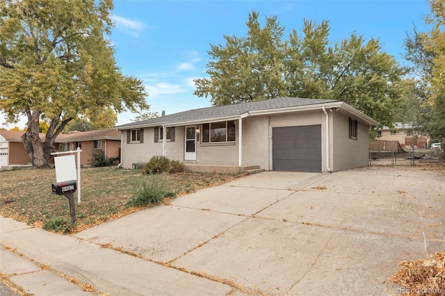 8467 W 62nd Pl, Arvada, CO 80004 - single story home with concrete driveway, an attached garage, and fence