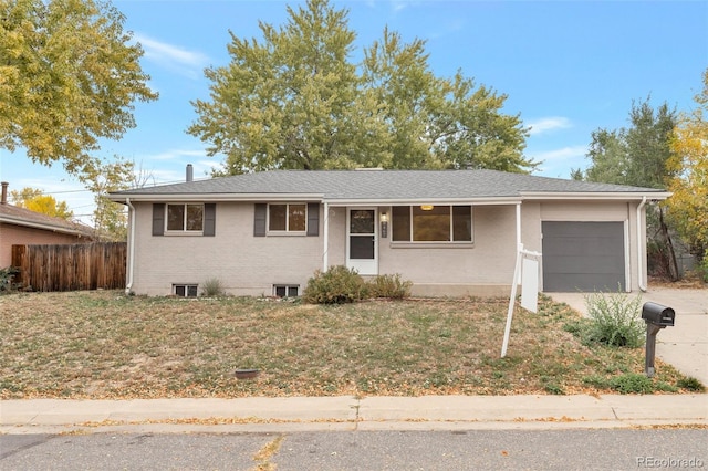 8467 W 62nd Pl, Arvada, CO 80004 - single story home with brick siding, a garage, fence, and driveway
