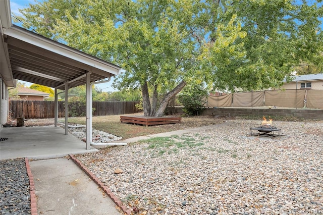 view of yard with a patio and a fire pit