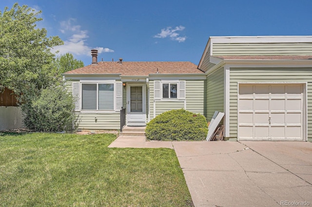 view of front facade with driveway, a front lawn, an attached garage, and a shingled roof