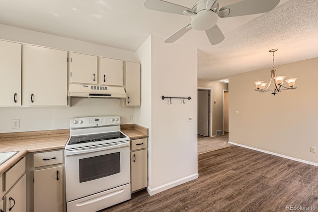 kitchen with electric range, under cabinet range hood, a chandelier, light countertops, and dark wood-style flooring