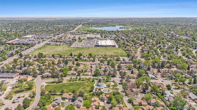 aerial view of property and surrounding area with a large body of water
