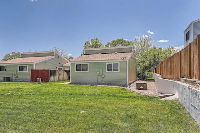 back of property with central AC