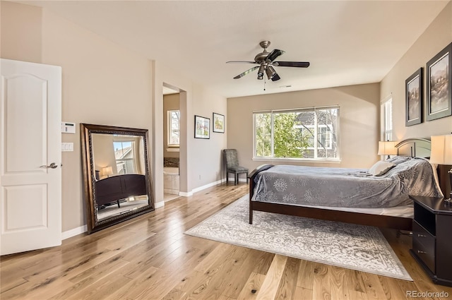 bedroom with ceiling fan, baseboards, and light wood-type flooring