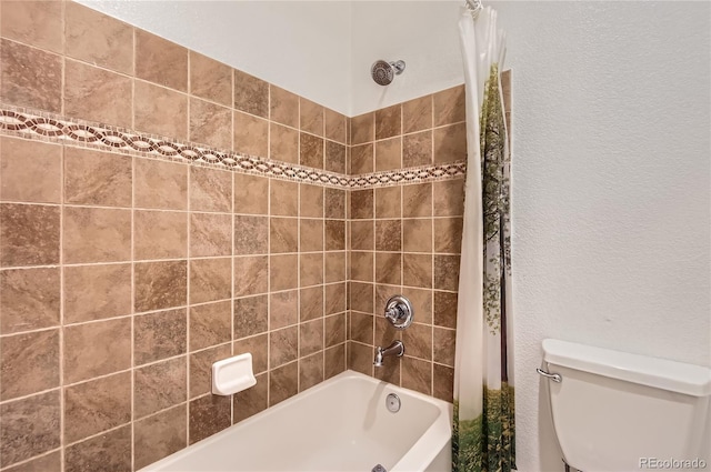bathroom with toilet and shower / bathtub combination with curtain