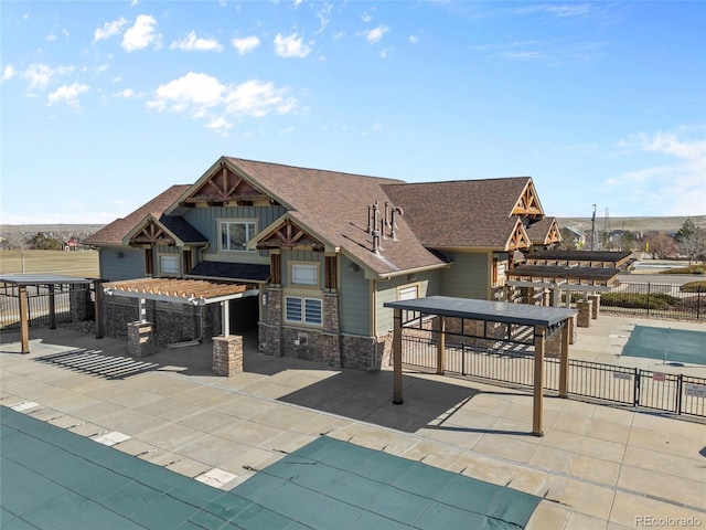 view of home's community featuring a patio area and fence