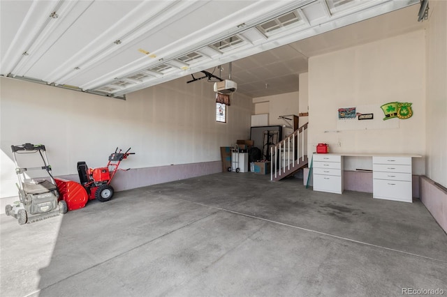 garage featuring a garage door opener