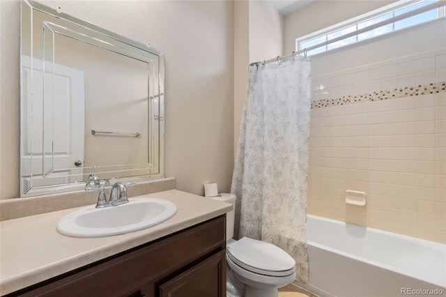 full bathroom with vanity, toilet, and shower / tub combo with curtain