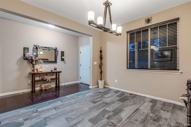 dining room with a notable chandelier and hardwood / wood-style floors