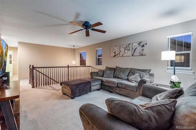 living room with light carpet and ceiling fan