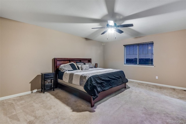 bedroom featuring ceiling fan and light carpet