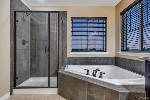 bathroom featuring shower with separate bathtub and tile patterned floors