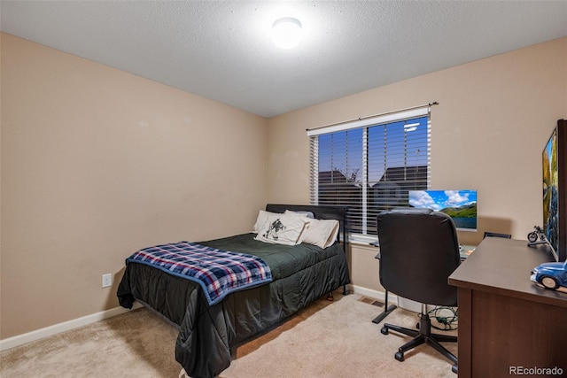 carpeted bedroom featuring a textured ceiling