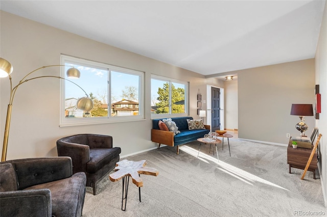 sitting room with carpet and baseboards