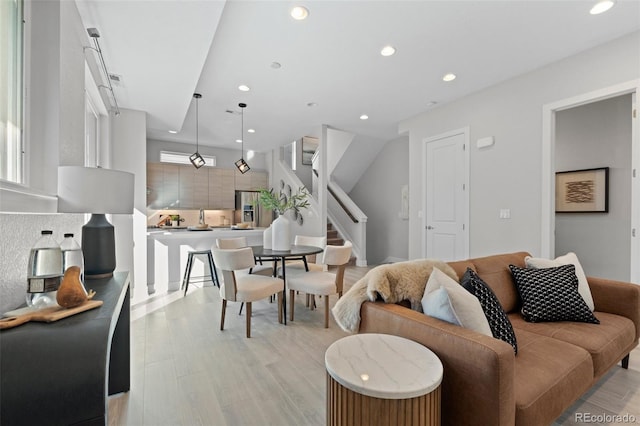 living room with light hardwood / wood-style flooring