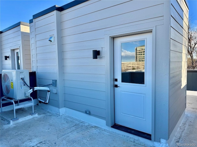 doorway to property featuring ac unit