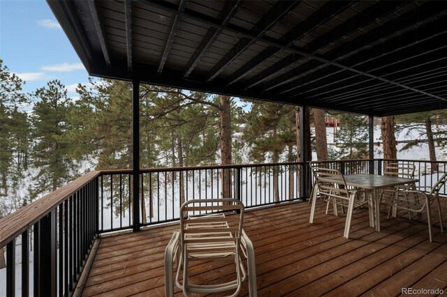 view of snow covered deck