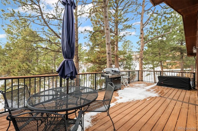 wooden terrace with area for grilling