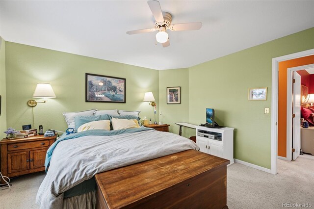 bedroom featuring light colored carpet and ceiling fan