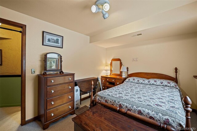 bedroom with light colored carpet