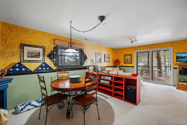 view of carpeted dining space