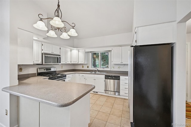 723 Eaton Rd, Palmer Lake, CO 80133 - kitchen with white cabinets, a peninsula, a sink, a chandelier, and appliances with stainless steel finishes