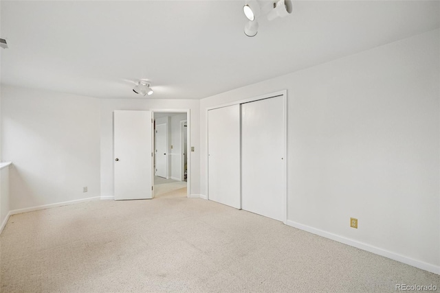 723 Eaton Rd, Palmer Lake, CO 80133 - unfurnished bedroom with baseboards, carpet flooring, and a closet