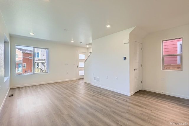 unfurnished room with light hardwood / wood-style floors