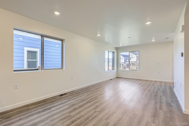 spare room featuring light hardwood / wood-style flooring