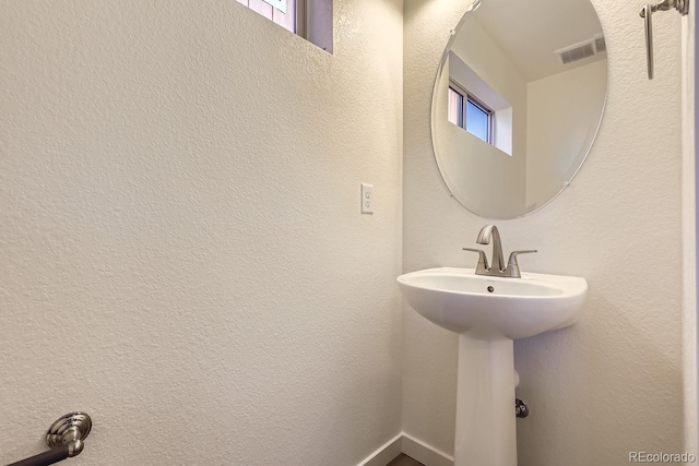 bathroom with sink and a wealth of natural light