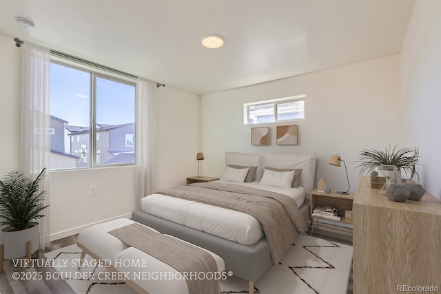 bedroom with hardwood / wood-style flooring