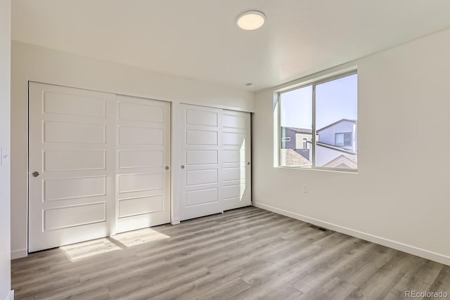 unfurnished bedroom featuring light hardwood / wood-style flooring