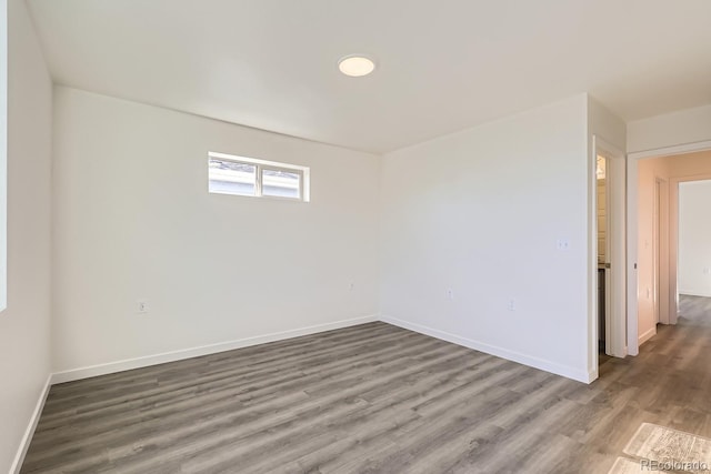 empty room with hardwood / wood-style floors