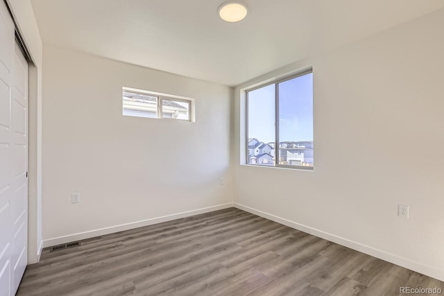 empty room featuring hardwood / wood-style flooring