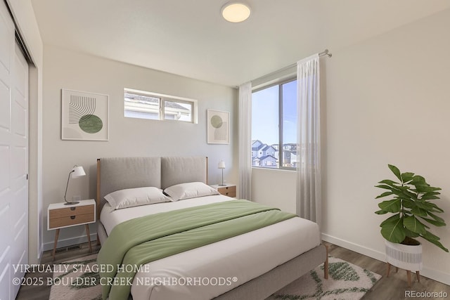 bedroom with hardwood / wood-style flooring