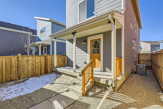 property entrance with cooling unit and covered porch