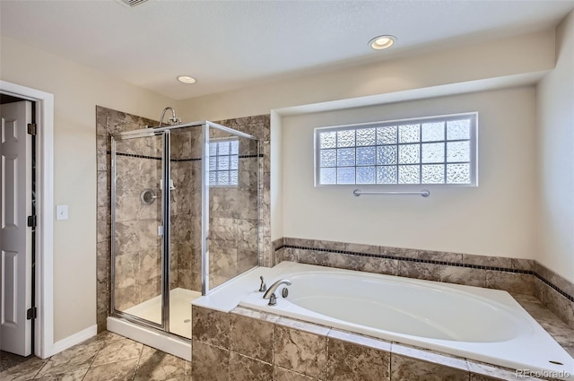 bathroom with recessed lighting, a shower stall, and a bath