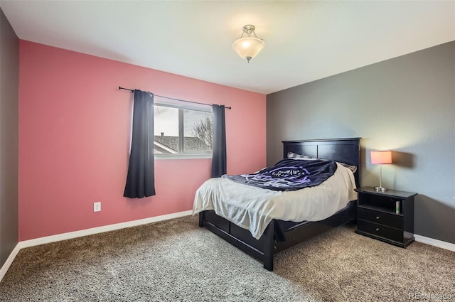 carpeted bedroom featuring baseboards