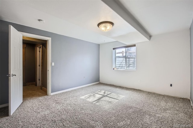 spare room with carpet flooring and baseboards