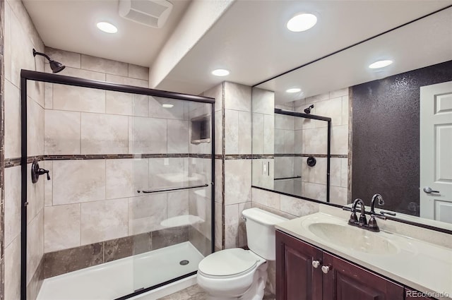 full bathroom with toilet, recessed lighting, visible vents, vanity, and a stall shower